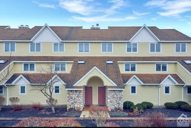a front view of a house with yard