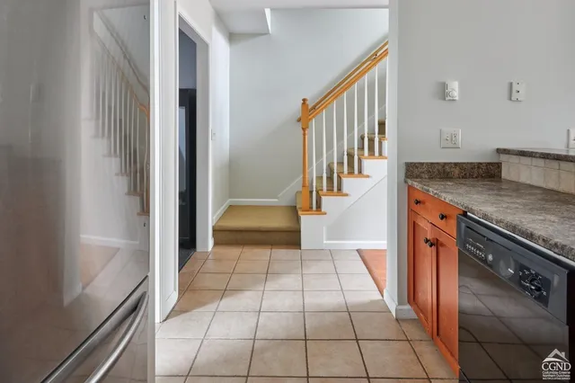 a view of a kitchen with a sink and dishwasher