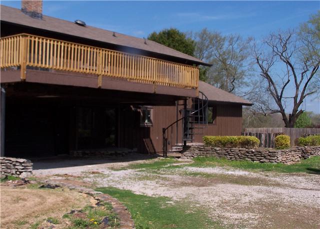 2407 Zion Road Columbia, TN 38401 - Photo 3 of 20 back of home - left side is garage. next to it is kitchen and has sliding patio door, and back patio, far right has stocked pond