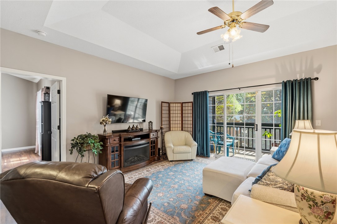160 Wexford Drive, Unit 206 Anderson, SC 29621 - Photo 7 of 31 Relax in this comfortable living space with a free-standing electric fireplace that provides heat for cozy nights at home. A seamless connection to the outdoors.