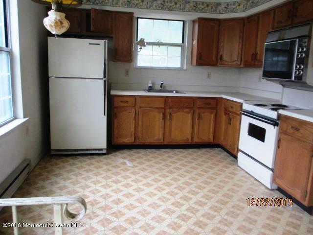 12 Alpine Road, Unit B Manchester Township, NJ 08759 - Photo 6 of 6 a kitchen with a refrigerator sink and cabinets