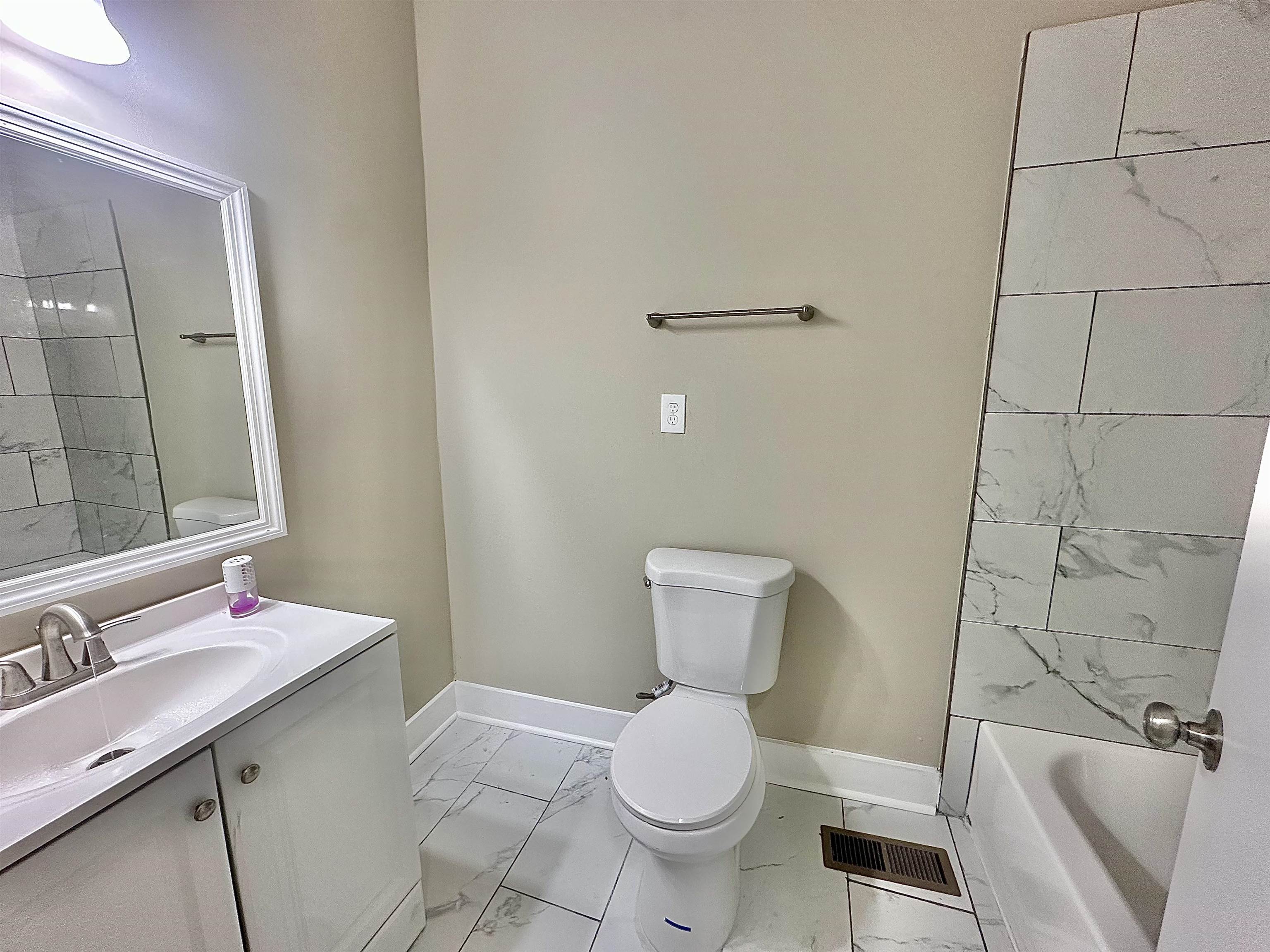 182 South Jefferson Street Ripley, TN 38063 - Photo 13 of 22 a bathroom with a sink toilet and shower