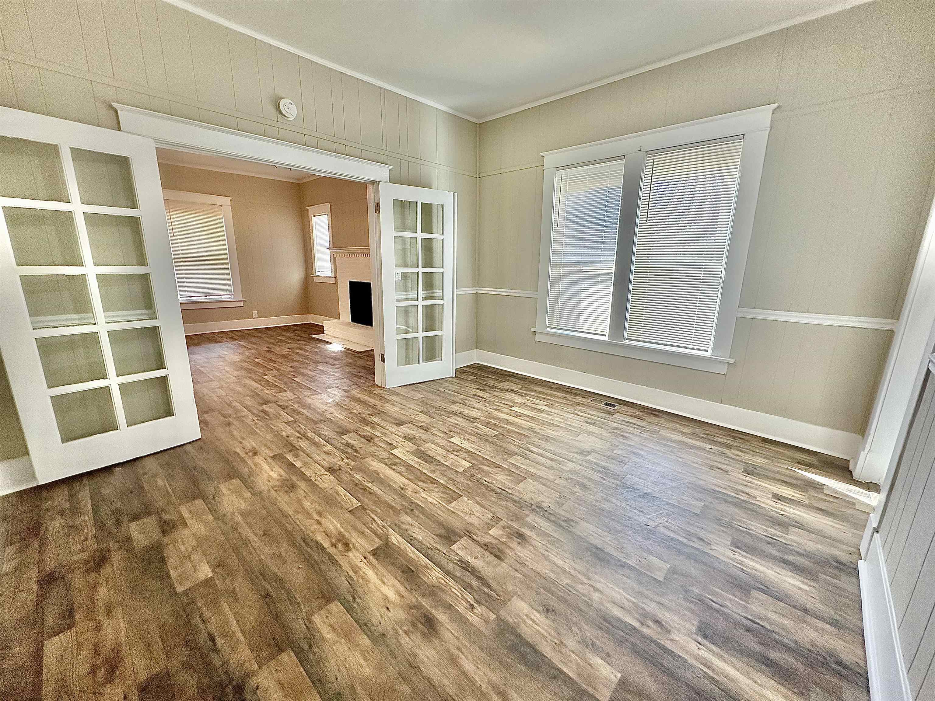 182 South Jefferson Street Ripley, TN 38063 - Photo 19 of 22 a view of an empty room with wooden floor and a window
