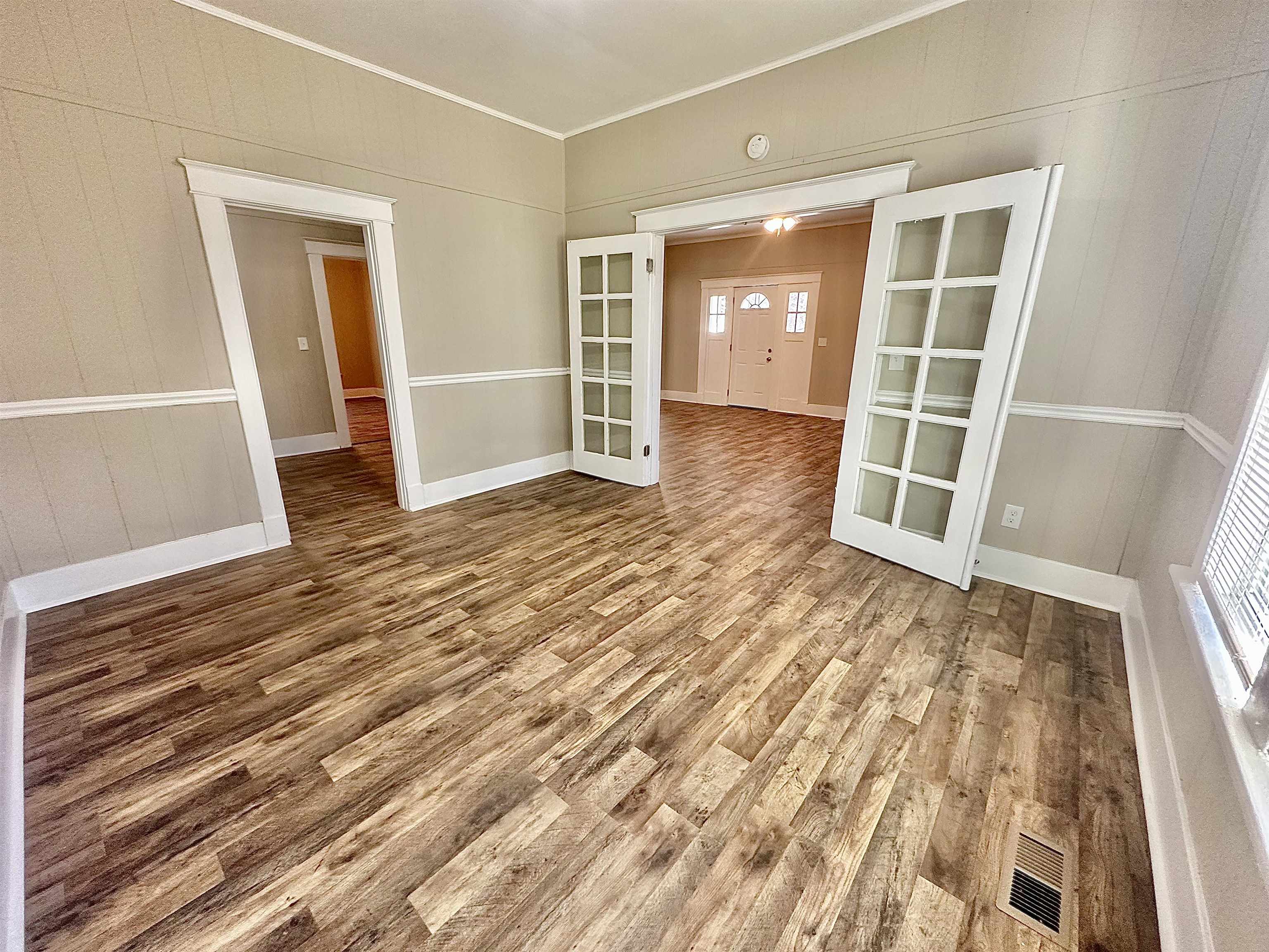 182 South Jefferson Street Ripley, TN 38063 - Photo 6 of 22 an empty room with wooden floor and closet