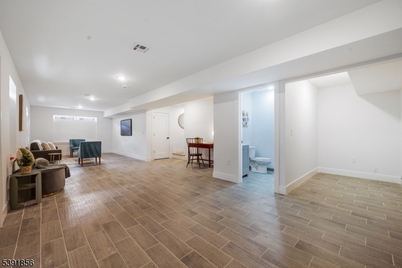 543 13th Avenue Newark, NJ 07103 - Photo 22 of 38 a view of a livingroom with furniture and a flat screen tv