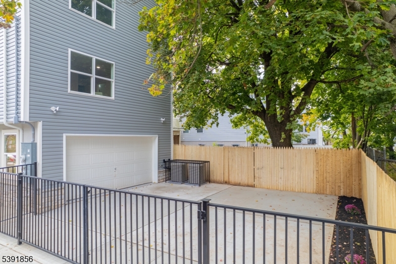 543 13th Avenue Newark, NJ 07103 - Photo 25 of 38 a front view of a house with a tree