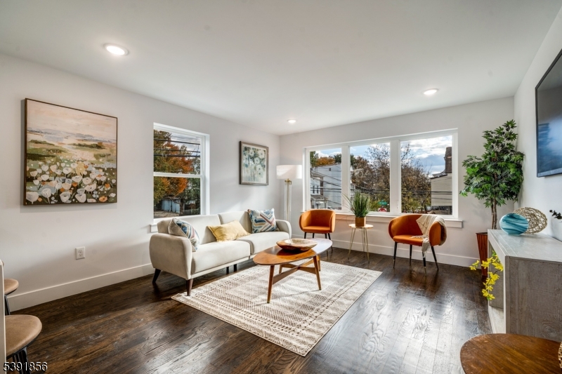 543 13th Avenue Newark, NJ 07103 - Photo 3 of 38 a living room with furniture and a large window