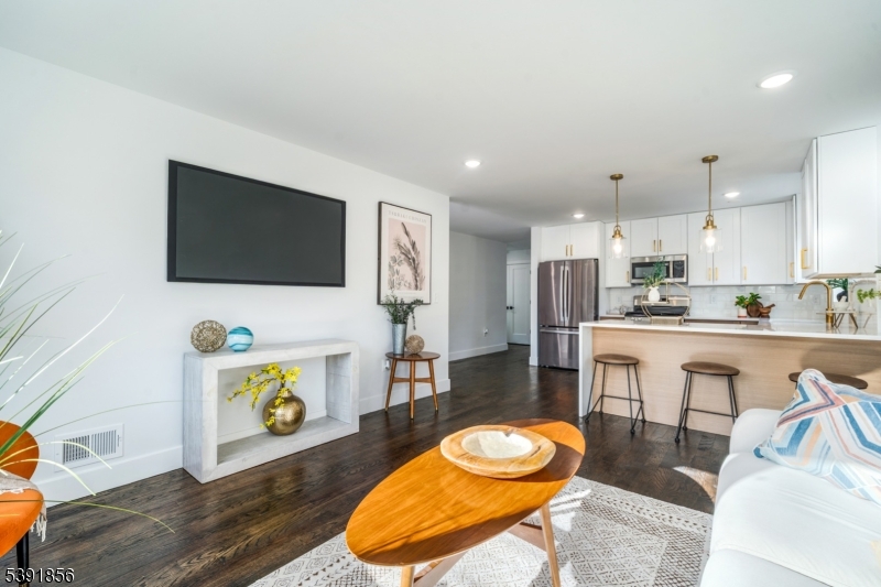 543 13th Avenue Newark, NJ 07103 - Photo 4 of 38 a living room with furniture and a flat screen tv