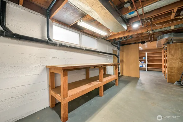 a view of an empty room with storage and utility