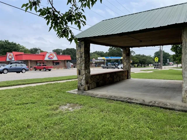 a room with furniture pool table and windows