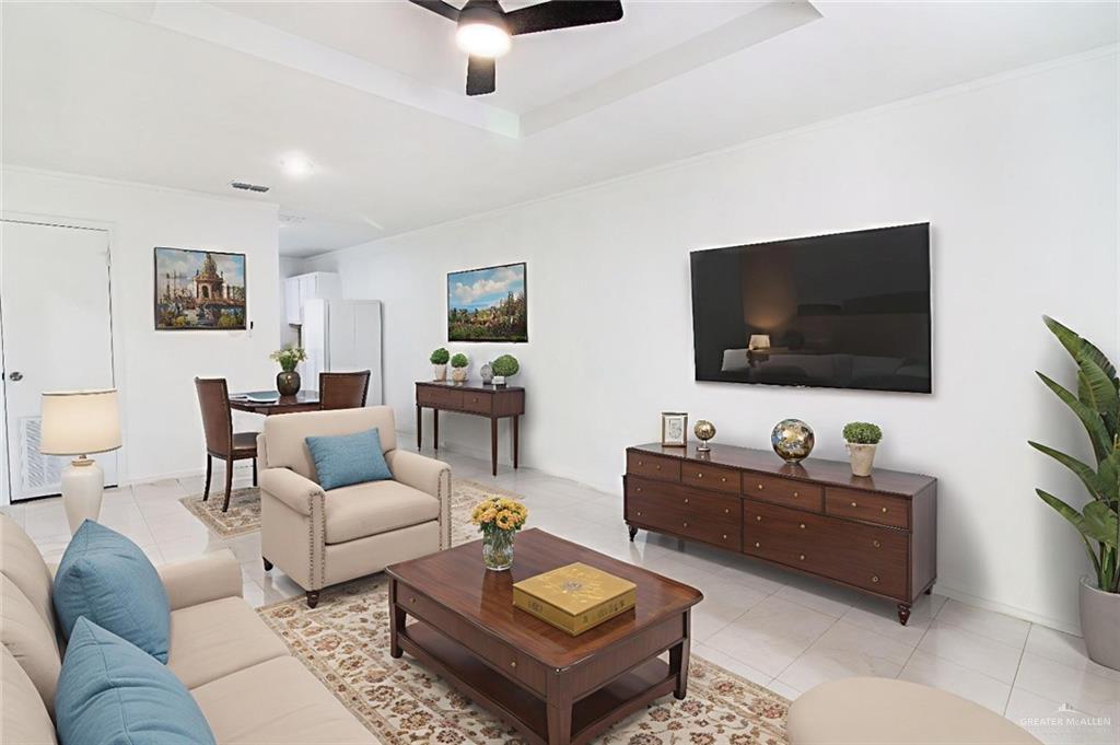 2612 West 17 1/2 Street, Unit 7 McAllen, TX 78504 - Photo 2 of 14 a living room with furniture and a flat screen tv