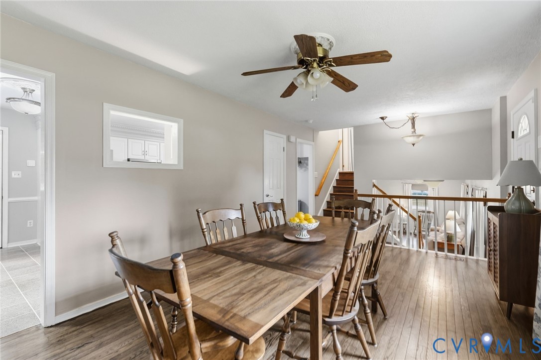 Wood-finish flooring throughout, ceiling fan with