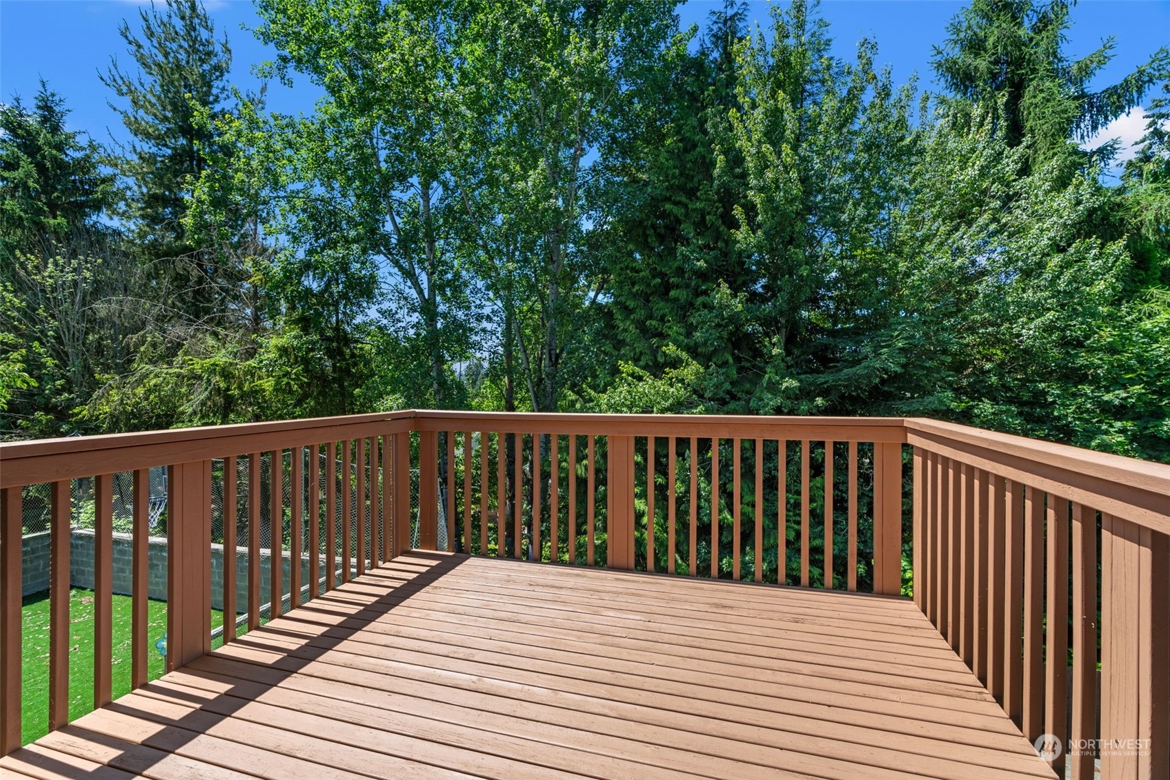 22622 41st Drive Southeast Bothell, WA 98021 - Photo 15 of 34 a balcony with wooden floor and fence