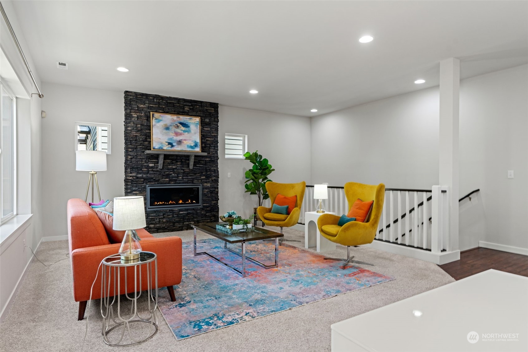 22622 41st Drive Southeast Bothell, WA 98021 - Photo 16 of 34 a living room with furniture a flat screen tv and a fireplace
