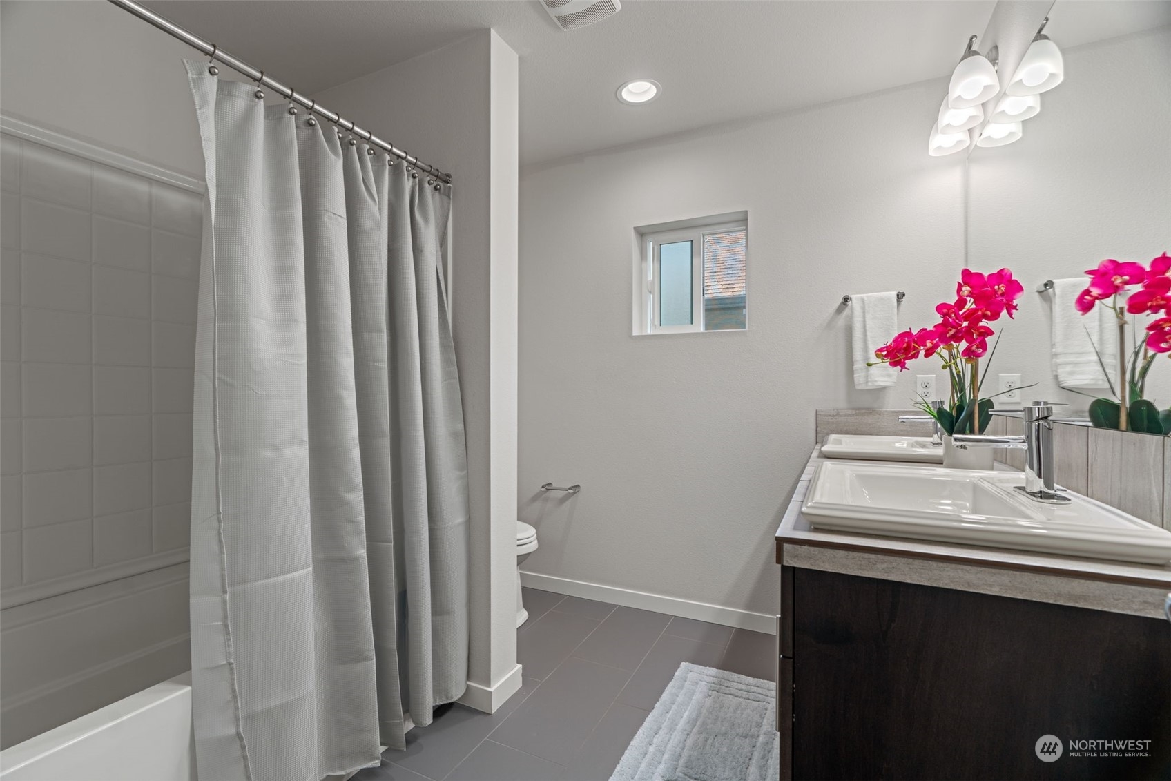 22622 41st Drive Southeast Bothell, WA 98021 - Photo 21 of 34 a bathroom with a sink vanity and a mirror