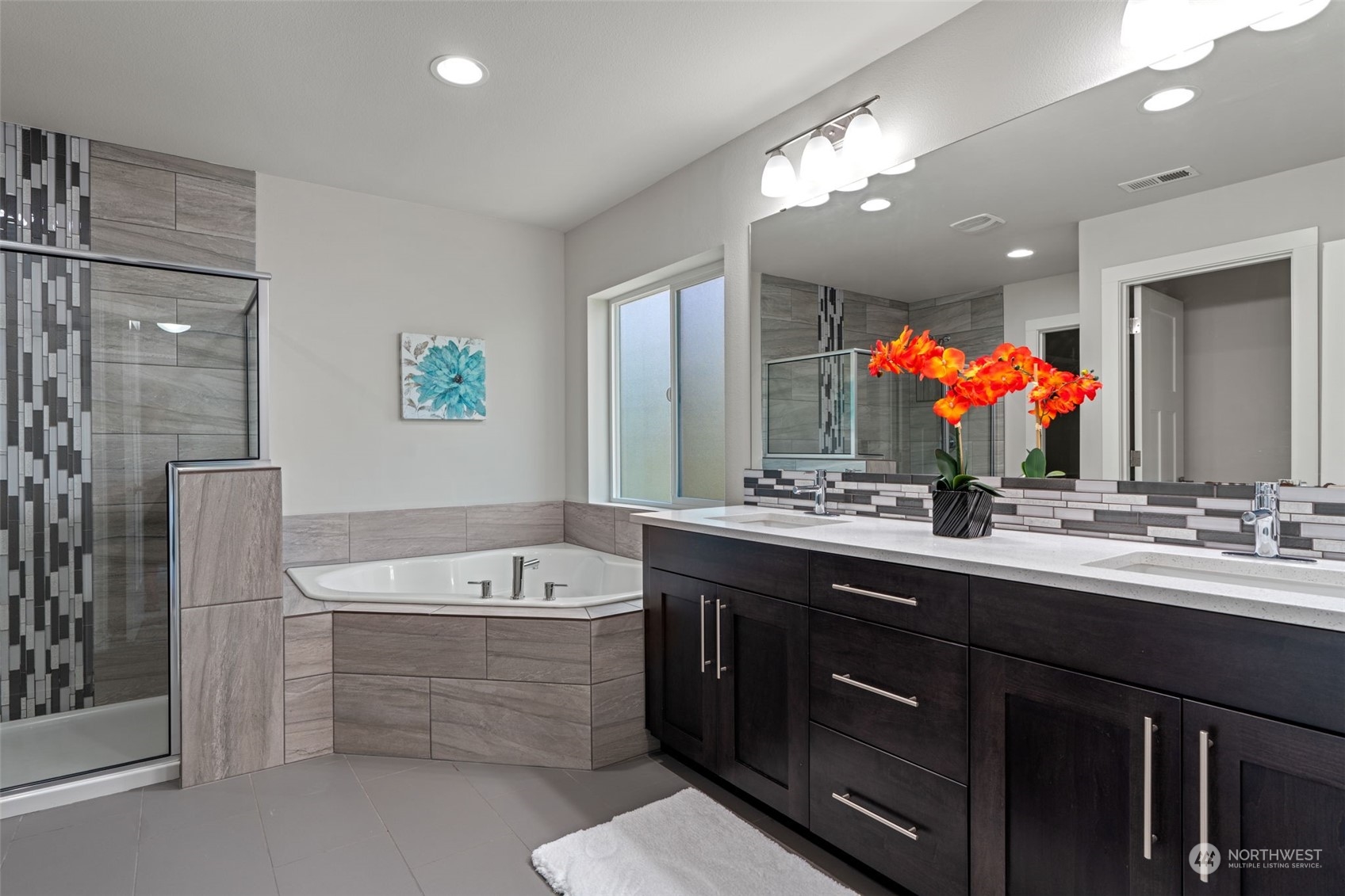 22622 41st Drive Southeast Bothell, WA 98021 - Photo 26 of 34 a bathroom with a tub a sink shower and mirror