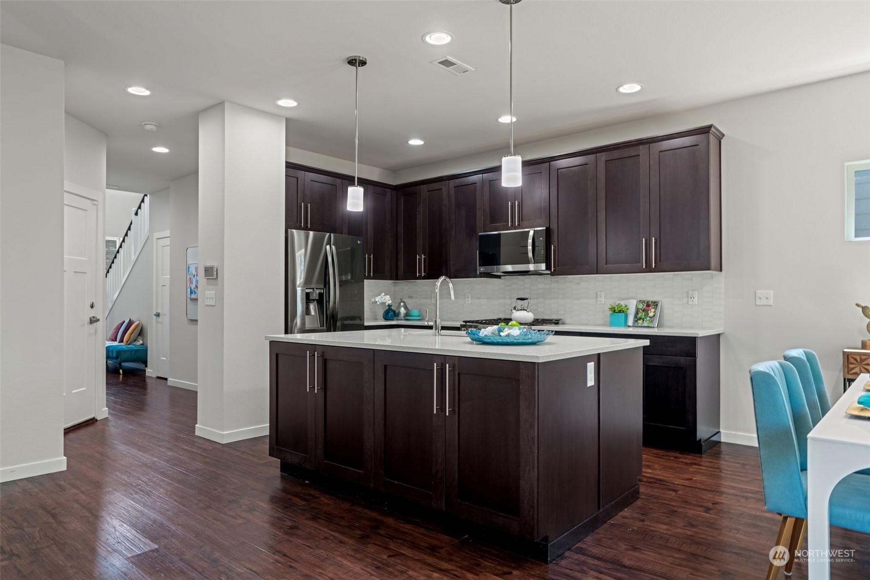22622 41st Drive Southeast Bothell, WA 98021 - Photo 9 of 34 a kitchen with stainless steel appliances granite countertop wooden cabinets a sink a stove a refrigerator and island with wooden floor