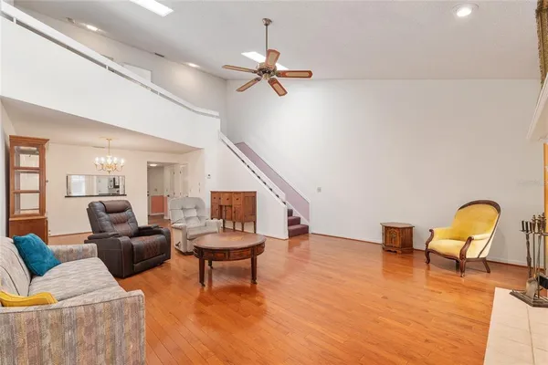 a living room with furniture fireplace and window