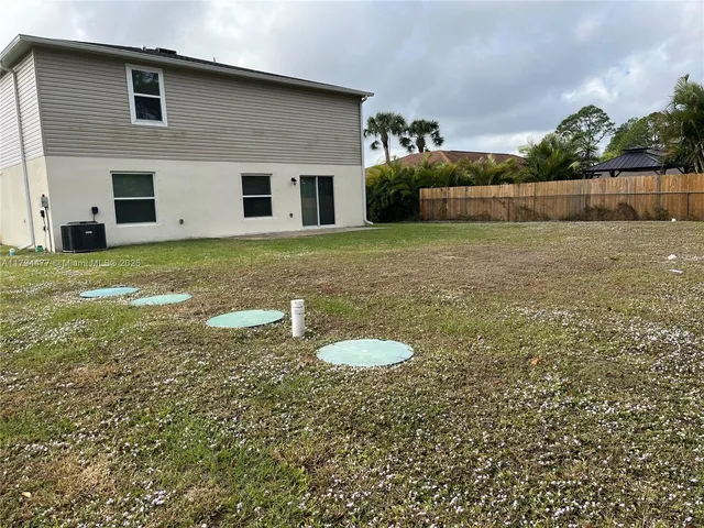 a backyard of a house with lots of green space