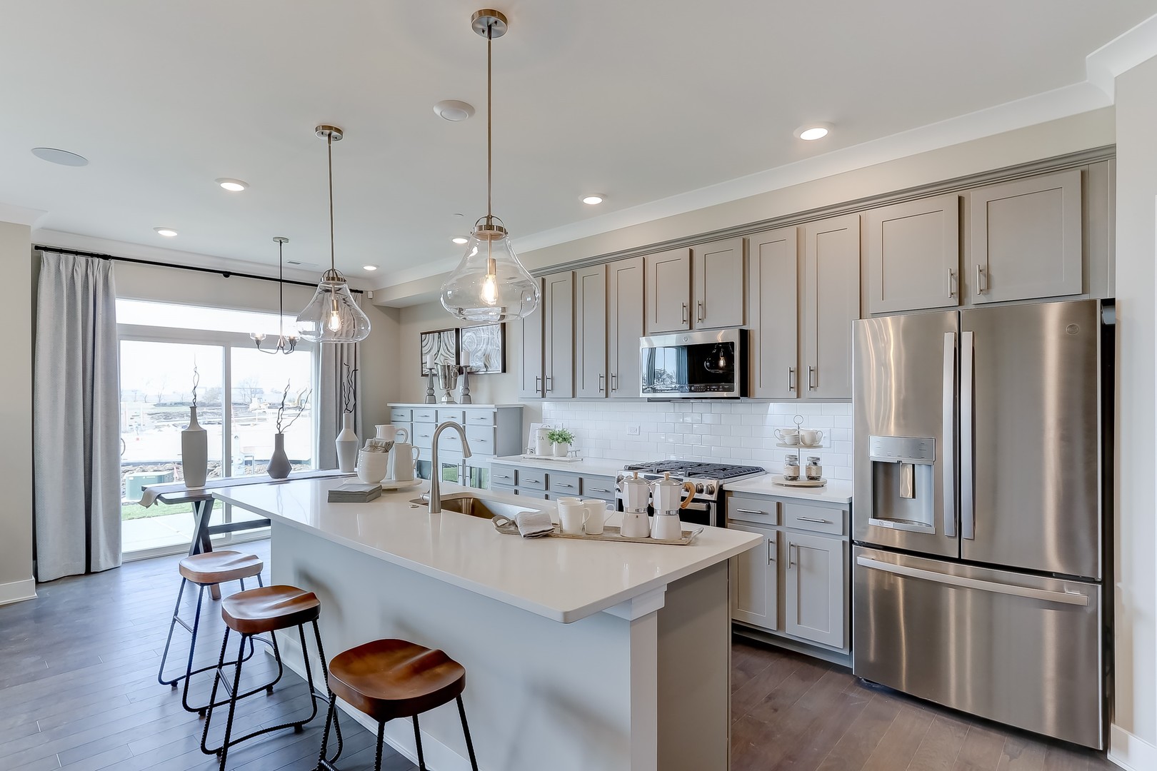 15455 Amelia Circle Lockport, IL 60441 - Photo 10 of 29 a kitchen with stainless steel appliances granite countertop a refrigerator a sink dishwasher a stove and a refrigerator with wooden floor