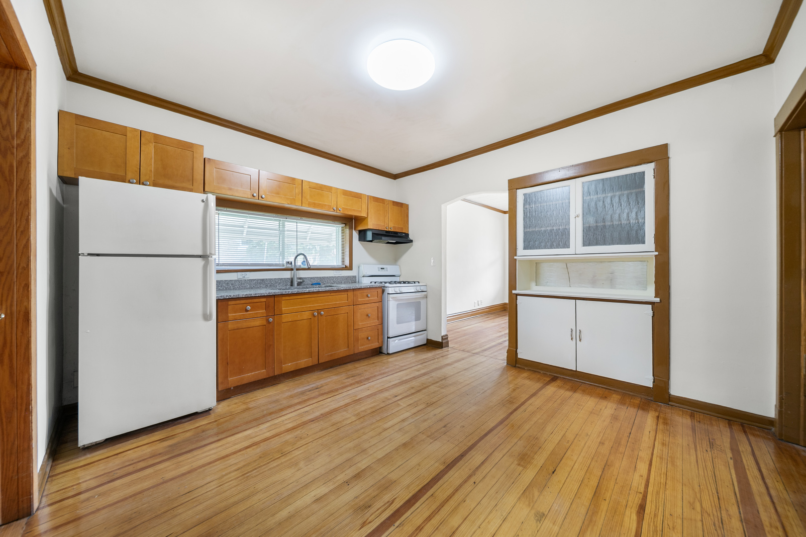 7120 41st Street Stickney, IL 60402 - Photo 4 of 13 a kitchen with a refrigerator and a stove top oven