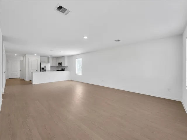 a view of empty room with kitchen appliances