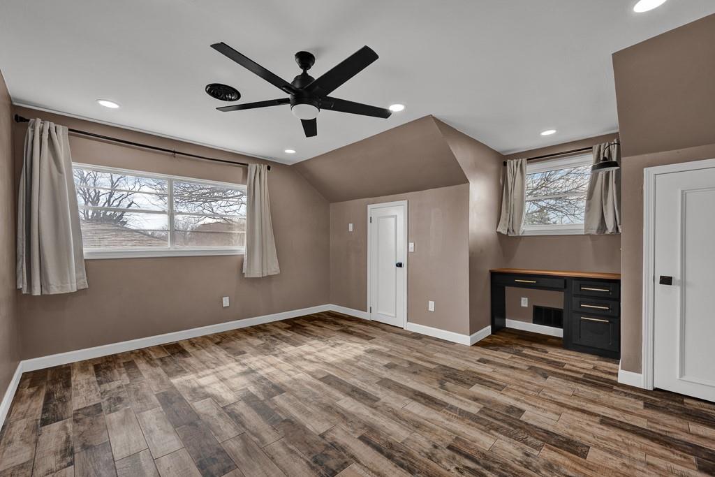 6117 Gainsborough Road Amarillo, TX 79106 - Photo 25 of 40 a view of an empty room with a window and a ceiling fan