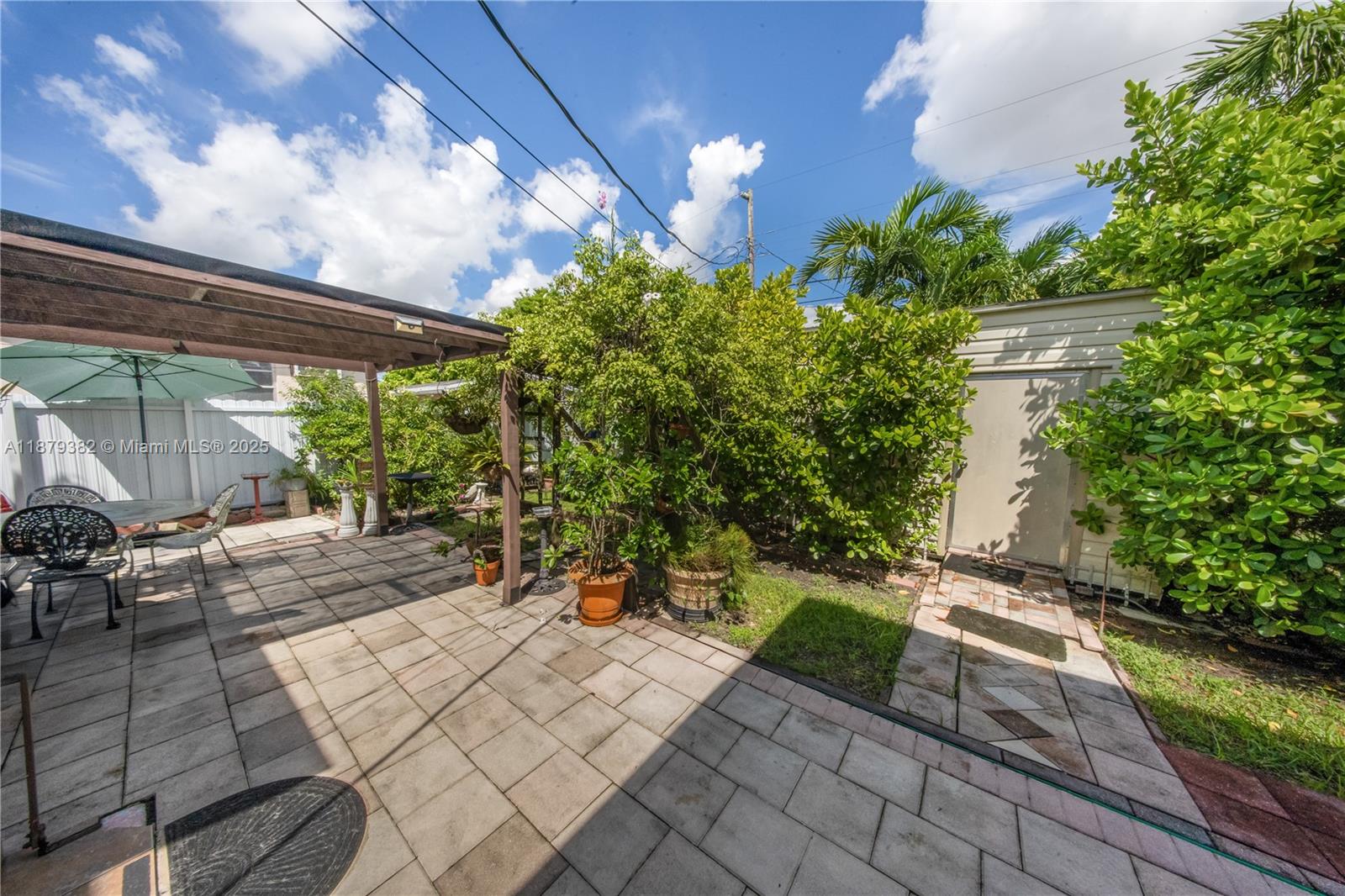 8341 Southwest 27th Lane Miami, FL 33155 - Photo 14 of 20 a view of yard with patio