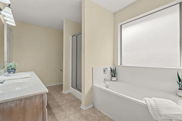 a bathroom with a bathtub and a sink