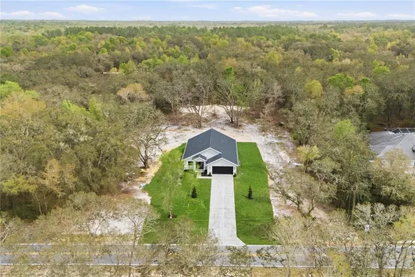 a front view of a house with yard