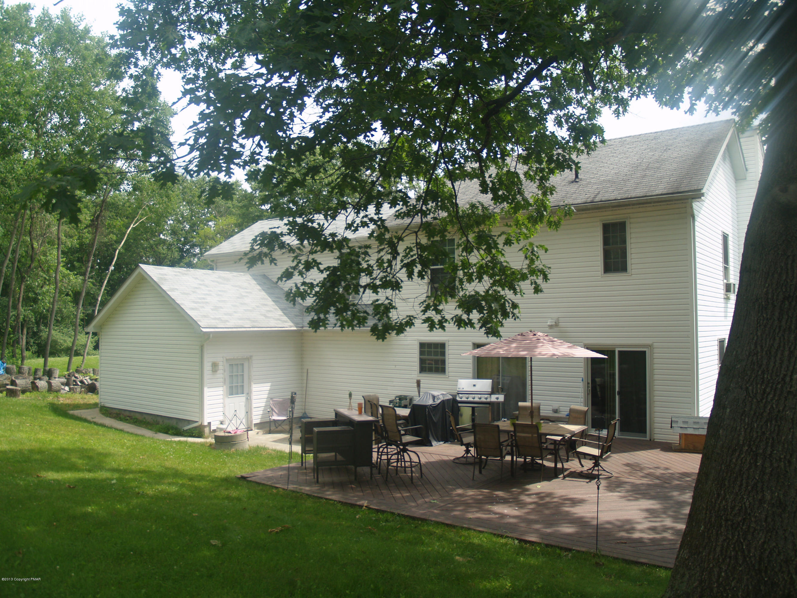 17 Dancing Ridge Road East Stroudsburg, PA 18302 - Photo 42 of 44 a view of backyard of house with outdoor seating and green space