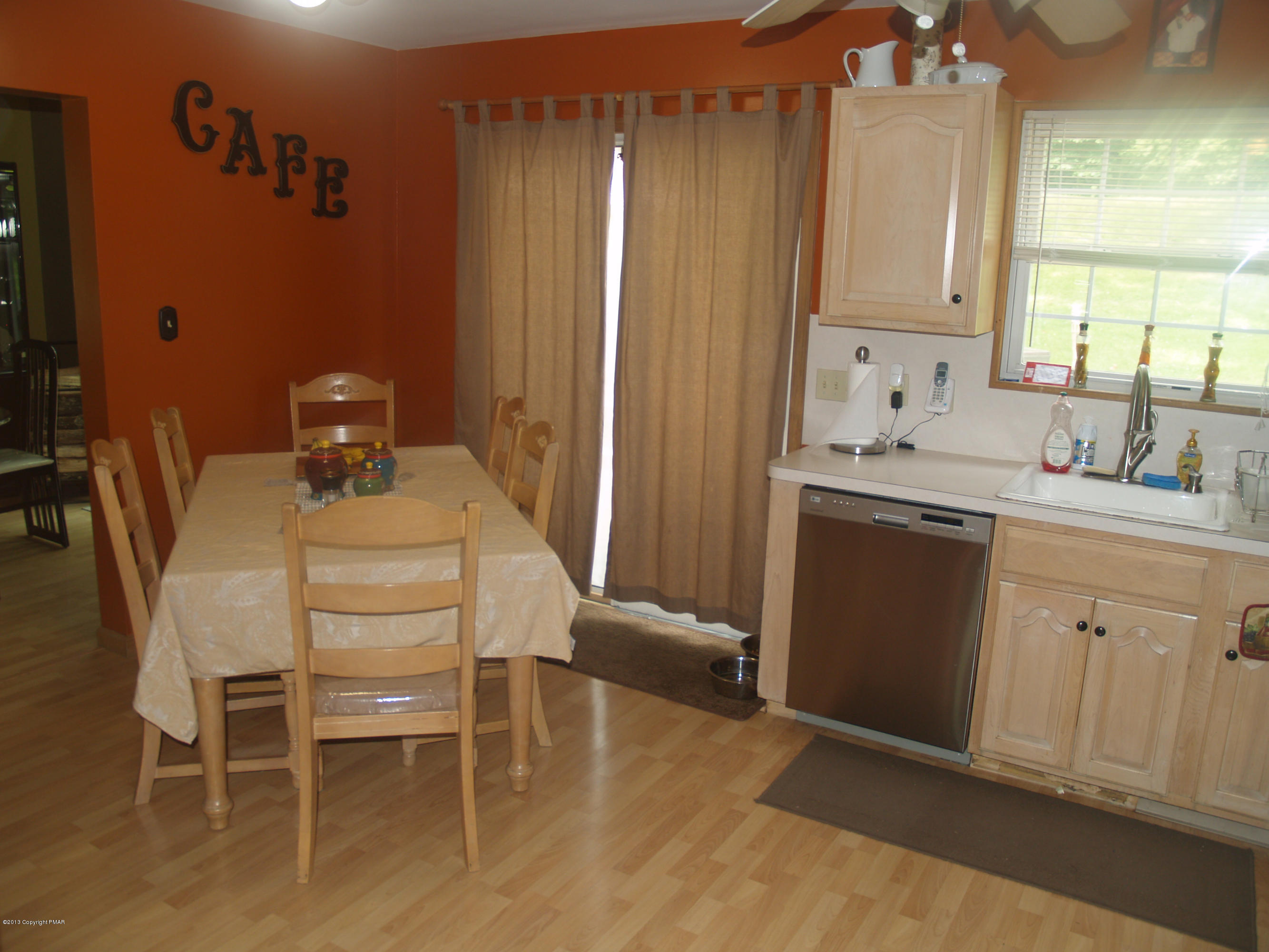 17 Dancing Ridge Road East Stroudsburg, PA 18302 - Photo 7 of 44 a kitchen with a sink chairs and cabinets