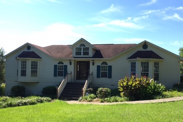 a front view of a house with a yard