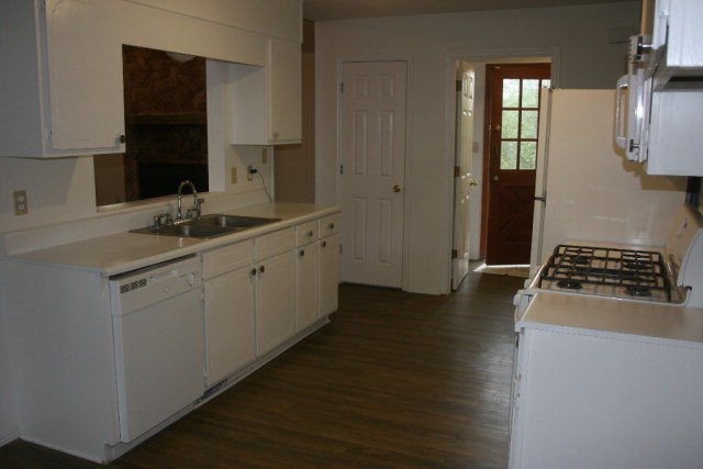 4648 Jones Road Macon, GA 31216 - Photo 5 of 10 a kitchen with a sink stove and cabinets