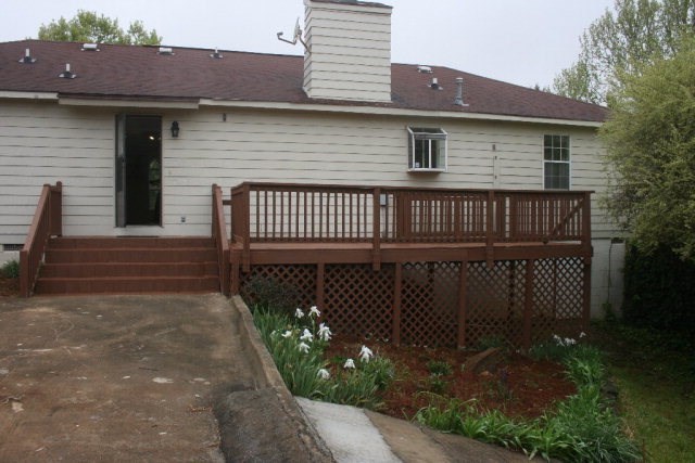 4648 Jones Road Macon, GA 31216 - Photo 7 of 10 a front view of a house with a garden
