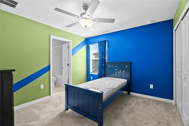 a bedroom with a bed and a dresser