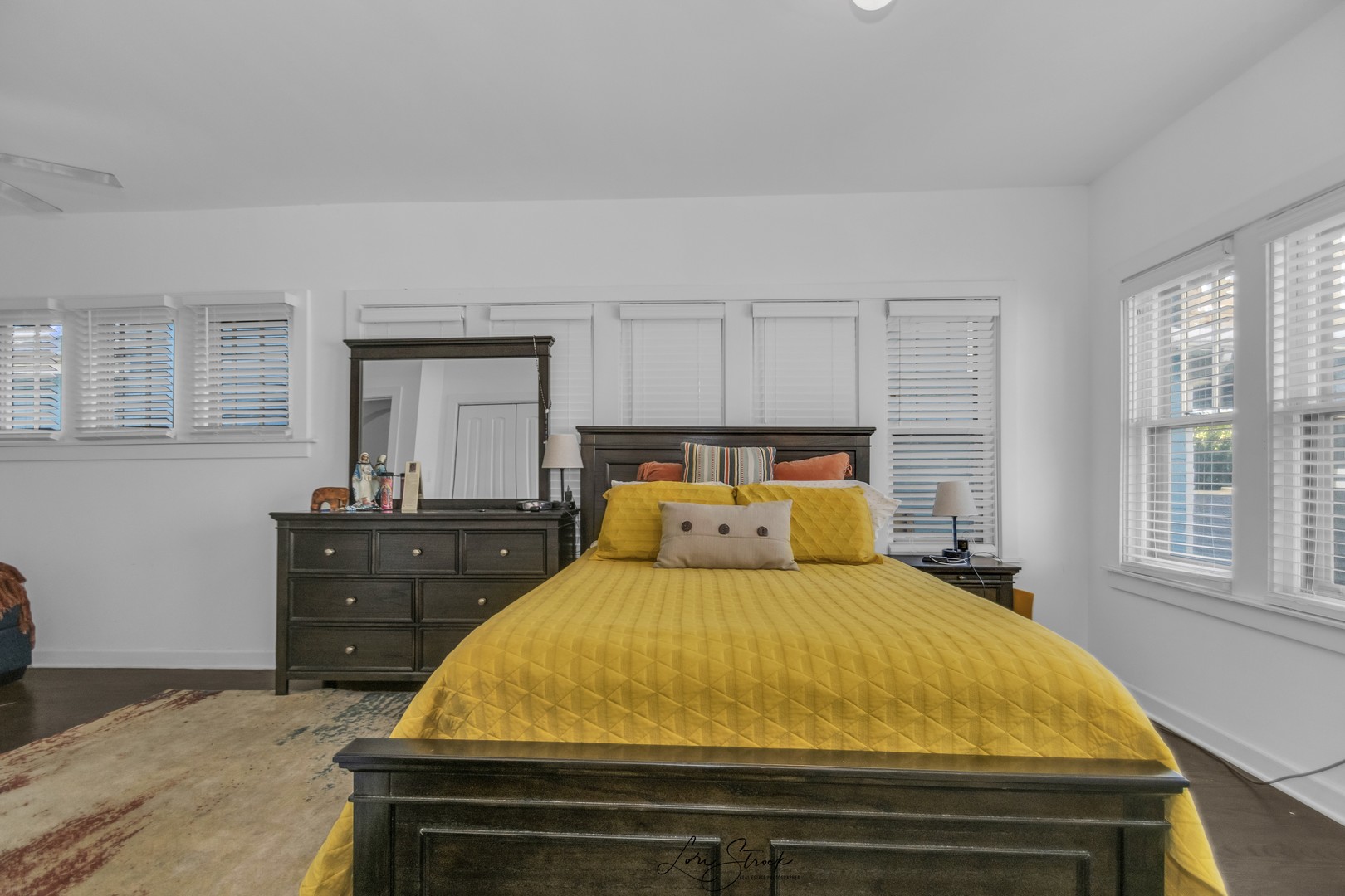 3637 North Pulaski Road Chicago, IL 60641 - Photo 11 of 34 a bed sitting in a bedroom next to a window with dresser