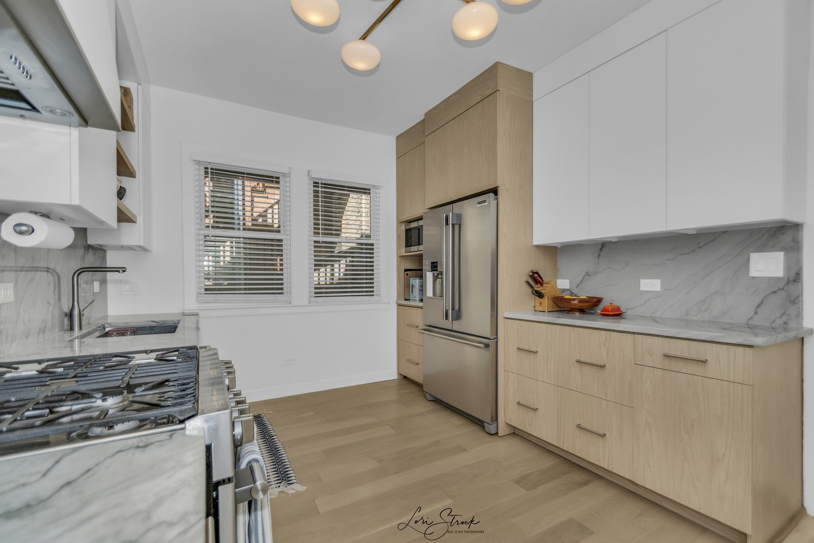 3637 North Pulaski Road Chicago, IL 60641 - Photo 18 of 34 a kitchen with granite countertop a sink stove and refrigerator