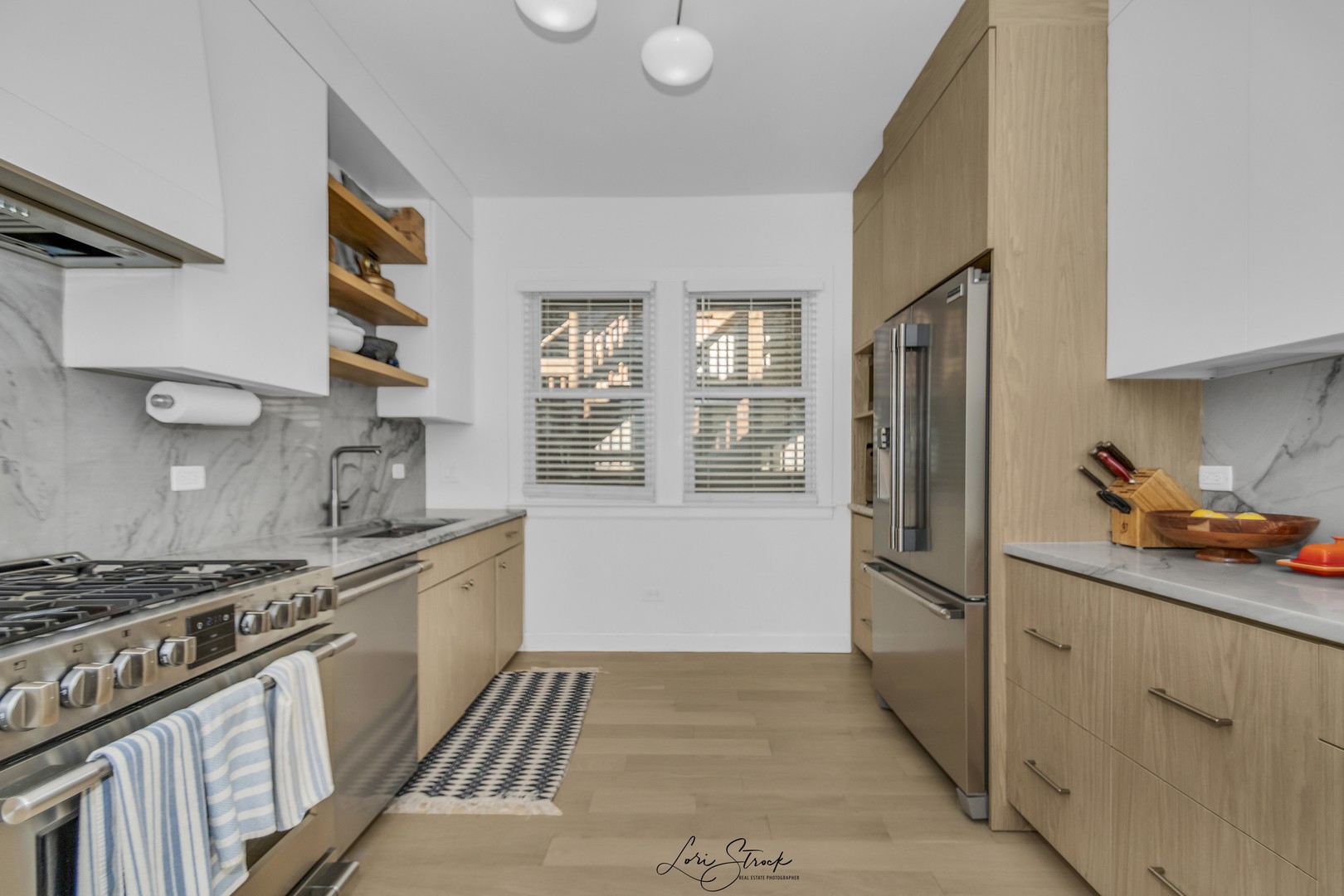 3637 North Pulaski Road Chicago, IL 60641 - Photo 19 of 34 a kitchen with stainless steel appliances a sink stove and refrigerator