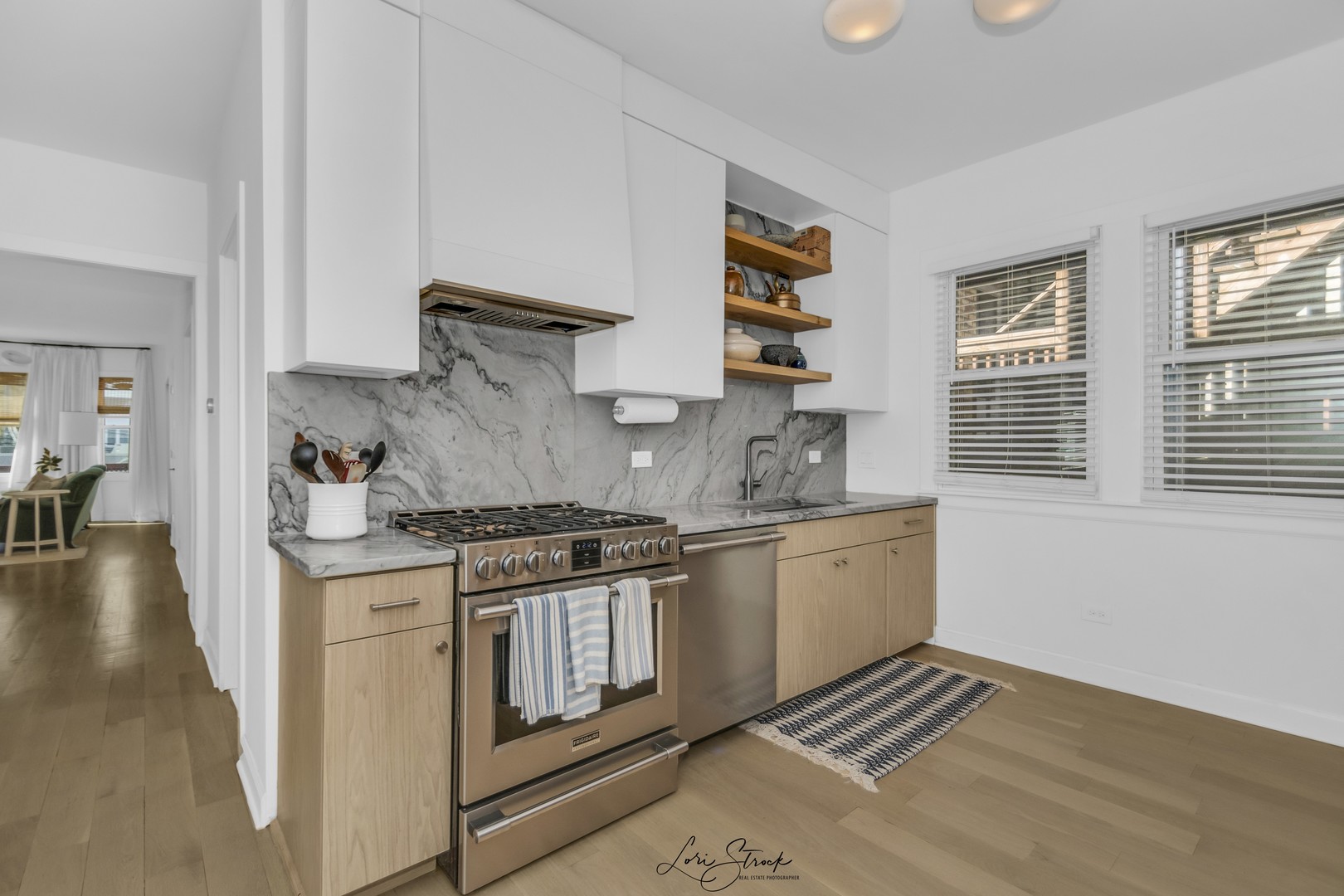 3637 North Pulaski Road Chicago, IL 60641 - Photo 20 of 34 a kitchen with stainless steel appliances granite countertop a stove and a sink