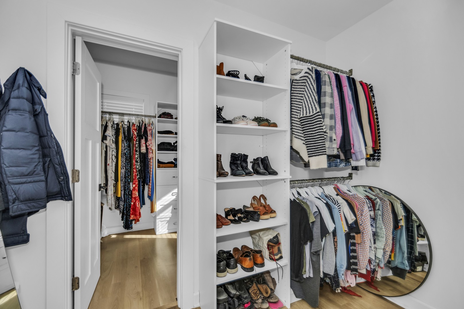 3637 North Pulaski Road Chicago, IL 60641 - Photo 23 of 34 a view of walk in closet with clothes and shoes