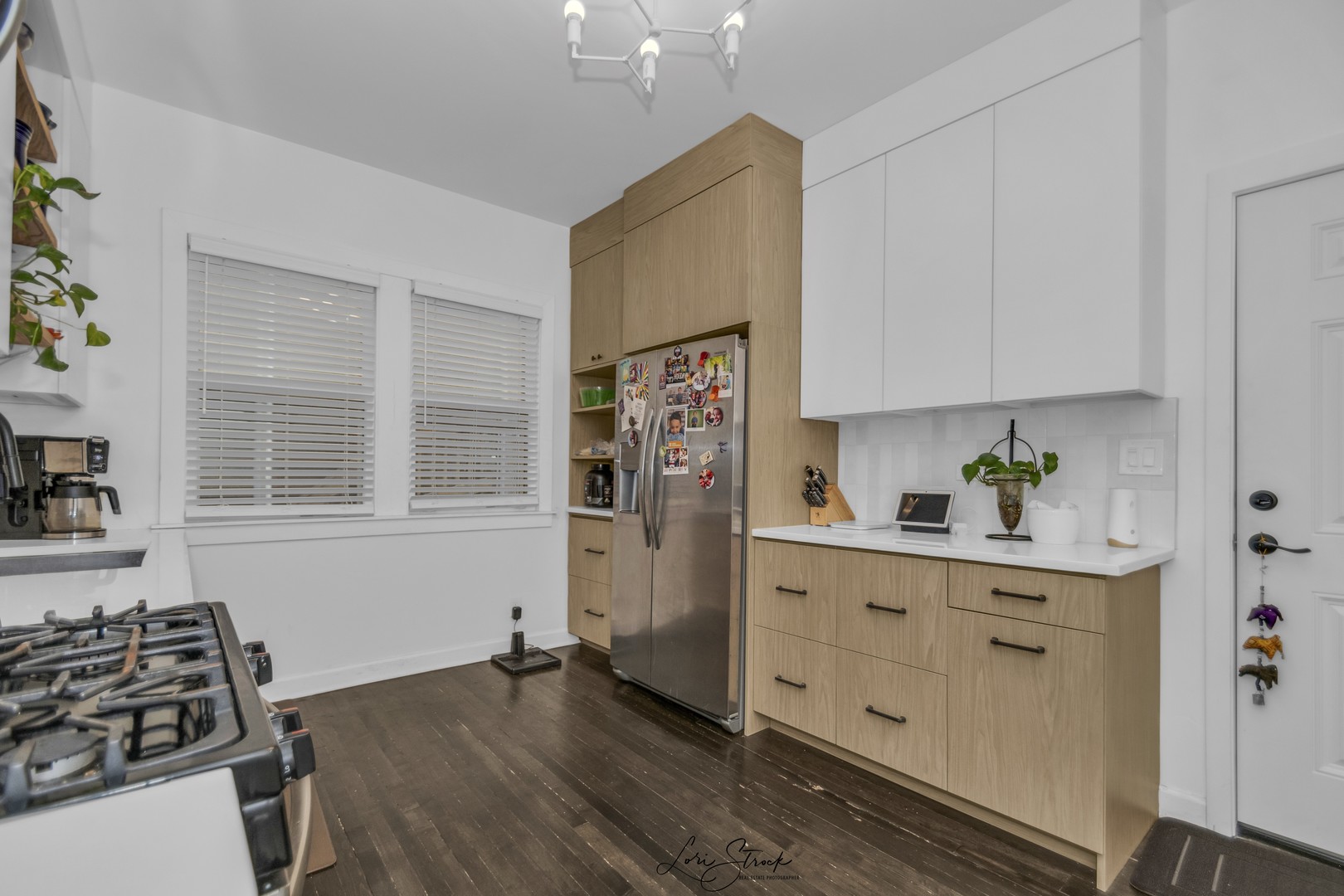 3637 North Pulaski Road Chicago, IL 60641 - Photo 8 of 34 a kitchen with stainless steel appliances a stove a refrigerator and cabinets