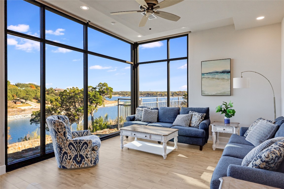 1101 Ivean Pearson Road, Unit B103 Lago Vista, TX 78645 - Photo 11 of 39 a living room with furniture and a large window