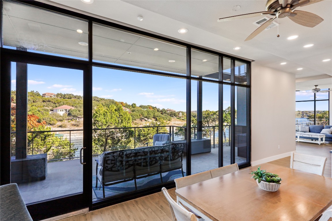 1101 Ivean Pearson Road, Unit B103 Lago Vista, TX 78645 - Photo 12 of 39 a view of a dining room with furniture window and outside view