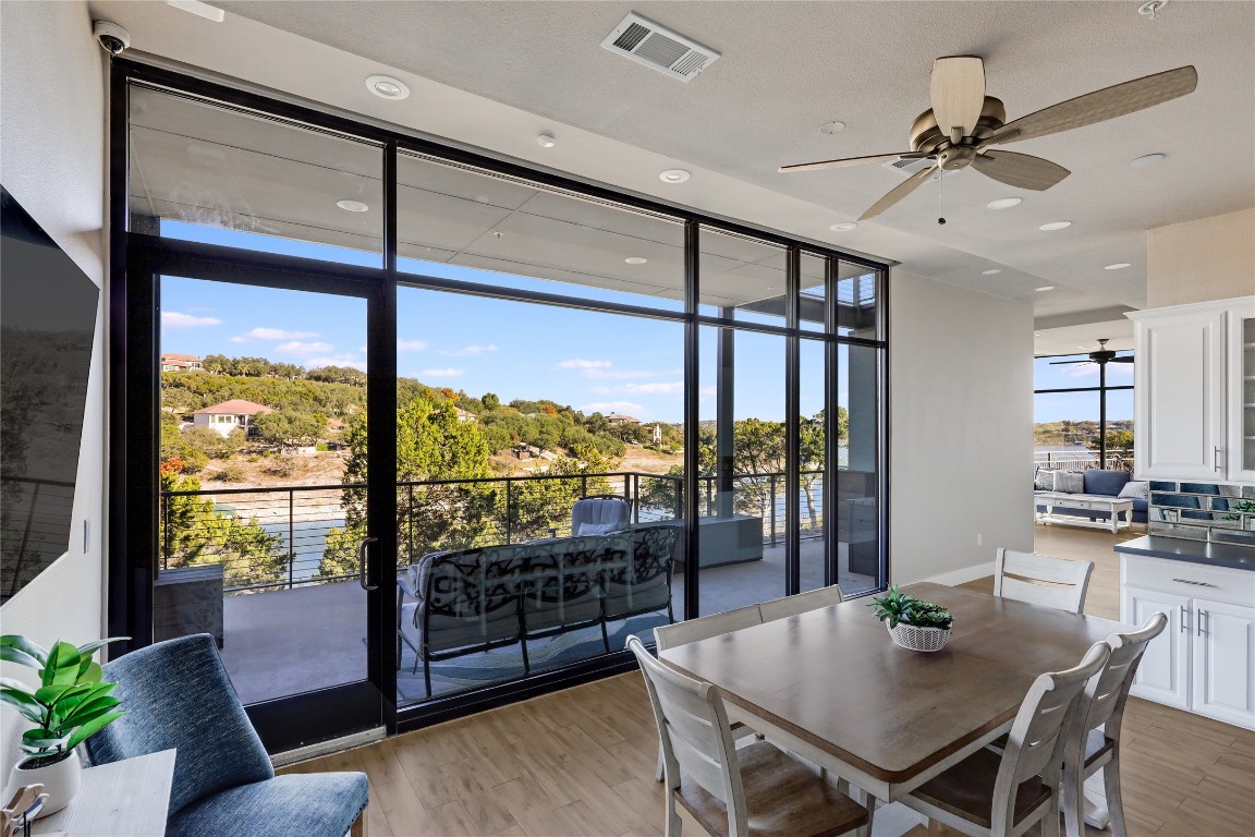 1101 Ivean Pearson Road, Unit B103 Lago Vista, TX 78645 - Photo 13 of 39 a view of a dining room with furniture window and outside view