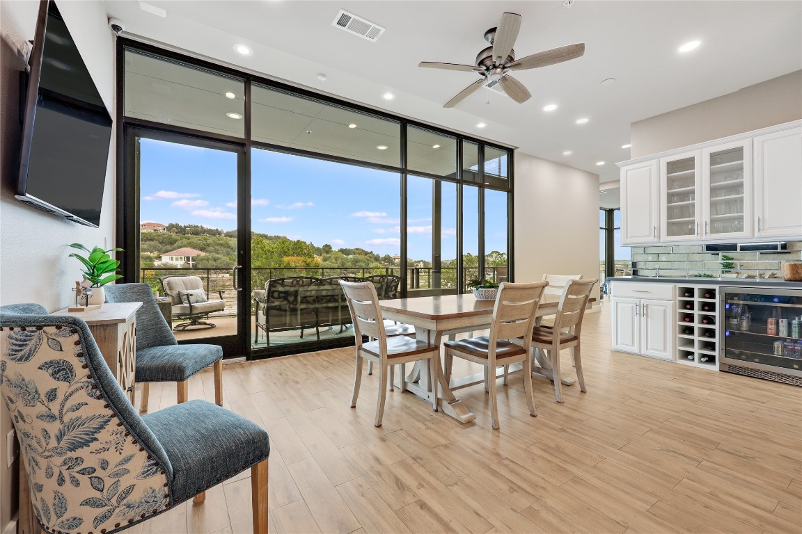 1101 Ivean Pearson Road, Unit B103 Lago Vista, TX 78645 - Photo 14 of 39 a dining room with furniture window and wooden floor