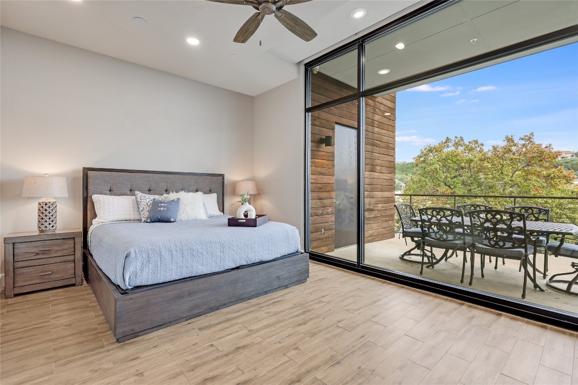 1101 Ivean Pearson Road, Unit B103 Lago Vista, TX 78645 - Photo 20 of 39 a bedroom with a bed and a night stand