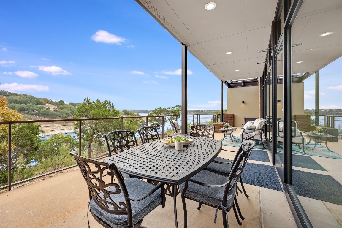 1101 Ivean Pearson Road, Unit B103 Lago Vista, TX 78645 - Photo 23 of 39 a view of a roof deck with table and chairs