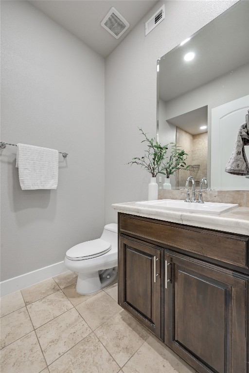 1101 Ivean Pearson Road, Unit B103 Lago Vista, TX 78645 - Photo 29 of 39 a bathroom with a sink a toilet and mirror