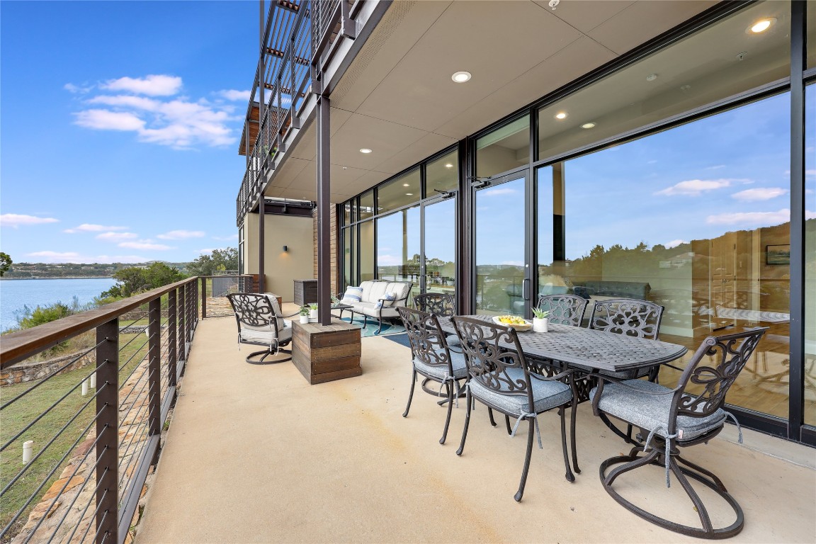 1101 Ivean Pearson Road, Unit B103 Lago Vista, TX 78645 - Photo 37 of 39 a dining room with furniture and city view
